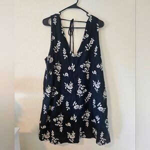 Black linen dress with floral detailing